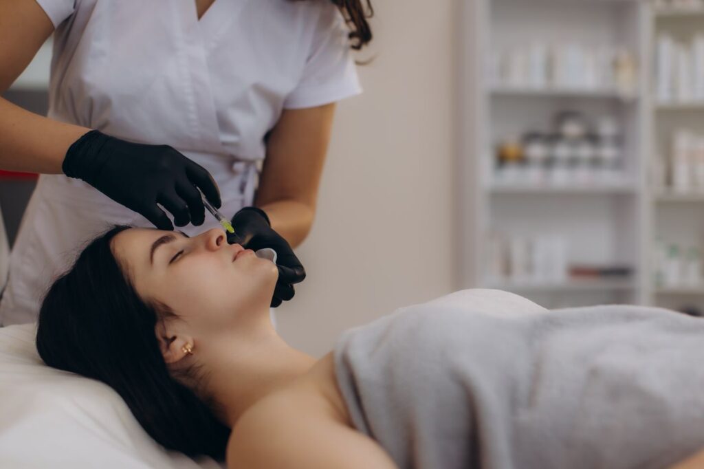 woman receiving facial filler injection at medical spa
