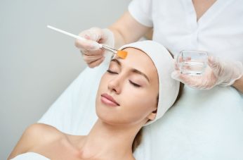 woman receiving chemical peel treatment at medical spa