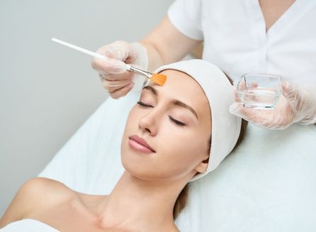 woman receiving chemical peel treatment at medical spa