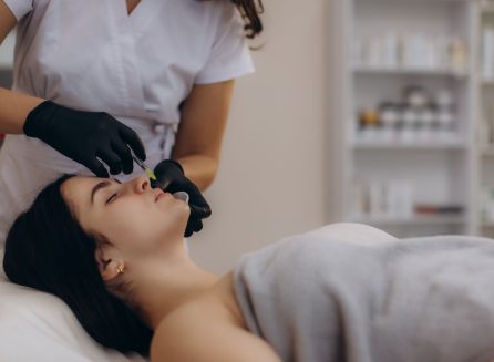 woman receiving facial filler injection at medical spa